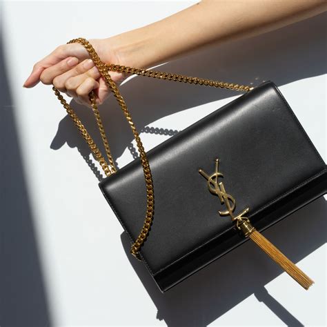 ysl purse black and gold|YSL black purse with tassel.